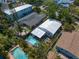 Aerial view showcasing the home, private pool, well-maintained landscaping, and neighborhood at 409 Erie Ave, Tampa, FL 33606