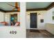 Cozy front porch with comfortable seating and a decorative ceiling fan at 409 Erie Ave, Tampa, FL 33606