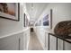 Hallway with paneled walls, neutral-toned floor, and decorative accents at 409 Erie Ave, Tampa, FL 33606