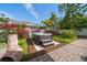 Relaxing hot tub nestled in a garden setting with colorful flowering bushes at 409 Erie Ave, Tampa, FL 33606