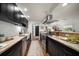 Beautiful gourmet kitchen with stainless appliances, custom cabinets and granite countertops for cooking and entertaining at 409 Erie Ave, Tampa, FL 33606