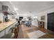 Open kitchen bar with seating overlooks the dining area with stylish decor and stainless appliances at 409 Erie Ave, Tampa, FL 33606