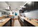 The renovated kitchen features custom cabinetry, granite countertops, stainless appliances and a farmhouse sink at 409 Erie Ave, Tampa, FL 33606
