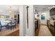 Open-concept layout showing kitchen with stainless appliances and adjacent dining area with stylish decor and lighting at 409 Erie Ave, Tampa, FL 33606