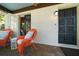 Charming outdoor patio area with stucco wall, brick flooring, and comfortable seating at 409 Erie Ave, Tampa, FL 33606