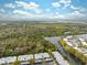 High-angle view showcasing single-story residences near a river with a picturesque wetland backdrop, perfect for nature lovers at 4235 Richmere Dr # 4235, New Port Richey, FL 34652