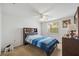 Comfortable bedroom with a queen-size bed, dresser, and a bright window for natural light at 4235 Richmere Dr # 4235, New Port Richey, FL 34652