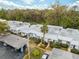 Close-up of attractive single-story homes boasting pretty landscaping, carports, and a welcoming facade with lots of curb appeal at 4235 Richmere Dr # 4235, New Port Richey, FL 34652