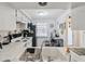 Bright kitchen featuring white cabinets, white appliances, and black refrigerator at 4235 Richmere Dr # 4235, New Port Richey, FL 34652