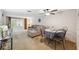 Open-concept living room with a dining area and sliding glass doors to the lanai at 4235 Richmere Dr # 4235, New Port Richey, FL 34652