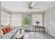 Bright sunroom featuring tiled floors, and multiple windows offering natural light and views of the outdoors at 4235 Richmere Dr # 4235, New Port Richey, FL 34652