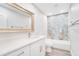 Bright bathroom with double vanity, marble tile shower, and modern fixtures at 4509 26Th S Ave, Tampa, FL 33619