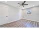 Clean bedroom featuring ceiling fan, window, closet and gray flooring at 4509 26Th S Ave, Tampa, FL 33619