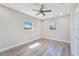 Empty bedroom with ceiling fan, window, and gray flooring at 4509 26Th S Ave, Tampa, FL 33619