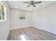 Bright bedroom featuring a ceiling fan, wood floors and a closet at 4509 26Th S Ave, Tampa, FL 33619