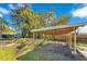 Exterior of the carport featuring a wooden frame and ample space for parking at 4509 26Th S Ave, Tampa, FL 33619