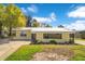 Charming home with a well-maintained front yard, showcasing curb appeal and landscaping at 4509 26Th S Ave, Tampa, FL 33619