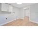 Spacious laundry room with storage cabinets and tile flooring at 4509 26Th S Ave, Tampa, FL 33619