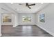 Spacious living room with updated floors, neutral paint, and abundant natural light at 4509 26Th S Ave, Tampa, FL 33619