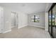 Bedroom featuring tiled floors and a view of the screened lanai at 4597 Blue Star Ct, North Port, FL 34289