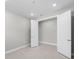 Empty bedroom with tile floor and walk-in closet at 4597 Blue Star Ct, North Port, FL 34289