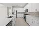 Well-equipped kitchen with quartz countertops and a subway tile backsplash at 4597 Blue Star Ct, North Port, FL 34289