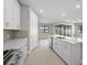 Spacious kitchen with a large island and seamless flow into the living area at 4597 Blue Star Ct, North Port, FL 34289