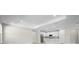 Open-concept living area, tiled floors, adjacent kitchen, and recessed lighting at 4597 Blue Star Ct, North Port, FL 34289