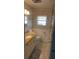 Cozy bathroom with tiled floor, vanity, toilet, and neutral decor at 46 Washington Ct # 28, Palm Harbor, FL 34684