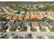 Neighborhood aerial view, featuring a lake, a golf course and tile roofs at 4802 Raintree Street E Cir, Bradenton, FL 34203