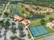 Aerial view of clubhouse and recreational facilities including pool and tennis courts at 4802 Raintree Street E Cir, Bradenton, FL 34203