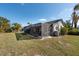 A private backyard boasts a large screened lanai, providing an inviting outdoor space to relax and entertain at 4802 Raintree Street E Cir, Bradenton, FL 34203