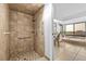 Bathroom featuring tiled shower, bathtub, vanity with double mirrors and abundant natural light at 5232 Kirkwood Ave, Spring Hill, FL 34608
