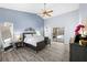 Bright bedroom with king bed, hardwood floors and slider access to private lanai at 5232 Kirkwood Ave, Spring Hill, FL 34608
