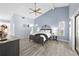 Spacious bedroom with vaulted ceilings, wood-look flooring and soft, natural light at 5232 Kirkwood Ave, Spring Hill, FL 34608