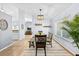 Cozy dining area with a light fixture, bar, and view to a living room at 5232 Kirkwood Ave, Spring Hill, FL 34608