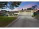 Charming single-story home featuring a well-manicured lawn and attached two-car garage at 5232 Kirkwood Ave, Spring Hill, FL 34608