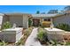 Charming front yard featuring a landscaped walkway and well-maintained greenery leading to the front door at 5232 Kirkwood Ave, Spring Hill, FL 34608