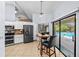 Bright kitchen with modern appliances and adjacent dining area overlooking the pool at 5232 Kirkwood Ave, Spring Hill, FL 34608