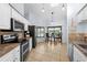 Kitchen with stainless appliances, granite countertops, and breakfast nook by window at 5232 Kirkwood Ave, Spring Hill, FL 34608