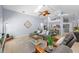 Spacious living room featuring a skylight, tile floors, and neutral décor at 5232 Kirkwood Ave, Spring Hill, FL 34608