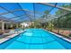 Gorgeous screened-in pool with ample deck space, perfect for entertaining and enjoying the outdoors at 5232 Kirkwood Ave, Spring Hill, FL 34608