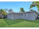 The backyard of this home features green grass with a privacy fence at 6208 Florida W Cir, Apollo Beach, FL 33572