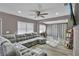 Open-concept living room with a large gray sofa and stylish decor at 6208 Florida W Cir, Apollo Beach, FL 33572
