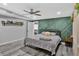 Stylish main bedroom with decorative green accent wall at 6208 Florida W Cir, Apollo Beach, FL 33572