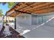 Spacious covered patio with wood ceilings leading to the backyard with room for outdoor seating at 6208 Florida W Cir, Apollo Beach, FL 33572