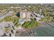 Stunning aerial view of condo building with pool and dock on the water at 700 N Osceola Ave # 504, Clearwater, FL 33755