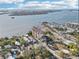 Scenic aerial view of complex with coastline and city skyline in the distance at 700 N Osceola Ave # 504, Clearwater, FL 33755
