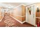 Well-maintained condo hallway featuring elegant wallpaper and decorative carpet at 700 N Osceola Ave # 504, Clearwater, FL 33755