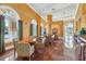Lounge area featuring multiple table and chair sets with arch windows and a view of the street at 700 N Osceola Ave # 504, Clearwater, FL 33755